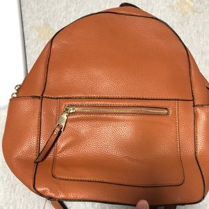 Tan leather backpack